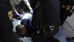 FILE - In this image taken from a nearly 18-minute video taken by a California Highway Patrol sergeant, Edward Bronstein, 38, is taken into custody by CHP officers on March 31, 2020, following a traffic stop in Los Angeles. Prosecutors on Wednesday, March 29, 2023, charged seven California Highway Patrol officers and a nurse with involuntary manslaughter in connection with the 2020 in-custody death of Edward Bronstein, who screamed "I can't breathe" while multiple officers restrained him as they tried to take a blood sample. (California Highway Patrol via AP, File)