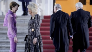German President Frank-Walter Steinmeier's wife Elke Buedenbender, left, and Camilla, the Queen Consort, talk in front of the Bellevue Palace in Berlin, Wednesday, March 29, 2023. King Charles III arrived Wednesday for a three-day official visit to Germany. (AP Photo/Markus Schreiber)