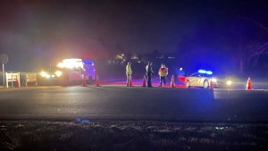 Emergency responders are seen near a site where two military helicopters crashed Wednesday night during a routine training mission in Trigg County, in southwestern Kentucky, on March 30, 2023. (Brandon Smith/WSMV-TV via AP)