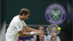 Russia's Daniil Medvedev plays a return to Poland's Hubert Hurkacz during the men's singles fourth round match on day eight of the Wimbledon Tennis Championships in London, Tuesday, July 6, 2021. Russian and Belarusian players will be able to compete at Wimbledon as neutral athletes after the All England Club on Friday, March 31, 2023, reversed its ban from last year. (AP Photo/Kirsty Wigglesworth, File)