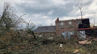 A home is damaged and trees are down after a tornado swept through Little Rock, Ark., Friday, March 31, 2023. (AP Photo/Andrew DeMillo)