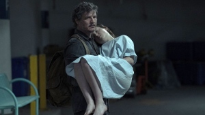 This image released by HBO shows Pedro Pascal, left, and Bella Ramsey in a scene from the series "The Last of Us." Vancouver Mayor Ken Sim says he's looking forward to seeing a post-apocalyptic version of city hall after announcing that hit HBO TV series "The Last of Us" will film season two in the city, moving from Alberta. THE CANADIAN PRESS/AP, HBO