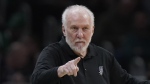 FILE - San Antonio Spurs head coach Gregg Popovich points from the bench in the second half of an NBA basketball game against the Boston Celtics, Sunday, March 26, 2023, in Boston. The Naismith Memorial Basketball Hall of Fame made it all official on Saturday, April 1, 2023 with three of the NBA’s all-time international greats — Dirk Nowitzki, Tony Parker and Pau Gasol — joining Dwyane Wade, Becky Hammon and Popovich as the headliners of the 2023 class that will be enshrined on Aug. 11 and 12 at ceremonies in Connecticut and Massachusetts.(AP Photo/Steven Senne, File)