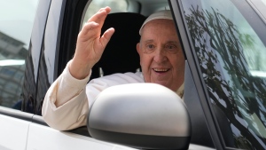 Pope Francis waves from his car as he leaves the Agostino Gemelli University Hospital in Rome, Saturday, April 1, 2023 after receiving treatment for a bronchitis, The Vatican said. Francis was hospitalized on Wednesday after his public general audience in St. Peter's Square at The Vatican. (AP Photo/Gregorio Borgia)
