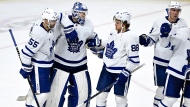 Toronto Maple Leafs goaltender Ilya Samsonov (35) is congradulated by teammates Mark Giordano (55) and William Nylander (88) after the team's win against the Ottawa Senators in NHL hockey action in Ottawa, on Saturday, April 1, 2023. THE CANADIAN PRESS/Justin Tang