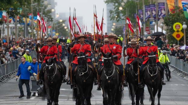 Royal Canadian Mounted Police in parade for Queen