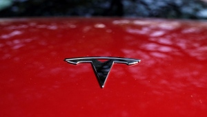 A Tesla logo is seen on a vehicle on display in Austin, Texas, Wednesday, Feb. 22, 2023. (AP Photo/Eric Gay, File) 