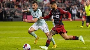 Toronto FC forward Lorenzo Insigne (24) plays the ball against Atlanta United defender Brooks Lennon (11) during second half MLS Soccer action in Toronto, on Saturday, April 15, 2023. THE CANADIAN PRESS/Andrew Lahodynskyj