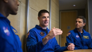 Canadian Space Agency astronaut Jeremy Hansen, centre, participates in interviews with fellow members of the Artemis II crew, NASA astronauts Victor Glover, left, Reid Wiseman, right, and Christina Hammock Koch, not shown, at the U.S. Embassy in Ottawa, Tuesday, April 25, 2023. THE CANADIAN PRESS/Justin Tang