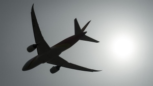 A plane is silhouetted as it takes off from Vancouver International Airport in Richmond, B.C., Monday, May 13, 2019.THE CANADIAN PRESS/Jonathan Hayward