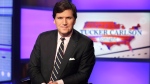 FILE - Tucker Carlson, host of "Tucker Carlson Tonight," poses for photos in a Fox News Channel studio on March 2, 2017, in New York. Fired Fox news host Carlson said Tuesday, May 9, 2023, that he will be putting out a â€œnew versionâ€ of his program on Twitter. (AP Photo/Richard Drew, File)
