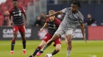 CF Montreal's Chinonso Offor (right) shields the ball from Toronto FC's Sigurd Rosted during first half Canadian Championship quarterfinal action in Toronto on Tuesday, May 9, 2023.THE CANADIAN PRESS/Chris Young