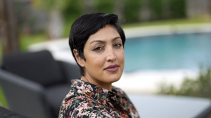 Rumman Chowdhury, co-founder of Humane Intelligence, a nonprofit developing accountable AI systems, poses for a photograph at her home Monday, May 8, 2023, in Katy, Texas. ChatGPT maker OpenAI, and other major AI providers such as Google and Microsoft, are coordinating with the Biden administration to let thousands of hackers take a shot at testing the limits of their technology. Chowdhury is the lead coordinator of the mass hacking event planned for this summer's DEF CON hacker convention in Las Vegas. (AP Photo/David J. Phillip)