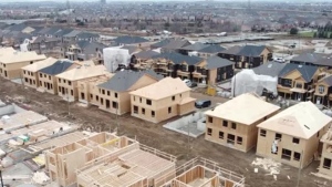 Homes under construction are pictured. 