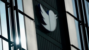 FILE - A Twitter logo hangs outside the company's offices in San Francisco, on Dec. 19, 2022. Twitter experienced a bevy of glitches Monday, March 6, 2023 as links stopped working, some users were unable to log in and images were not loading for others. (AP Photo/Jeff Chiu, File) 