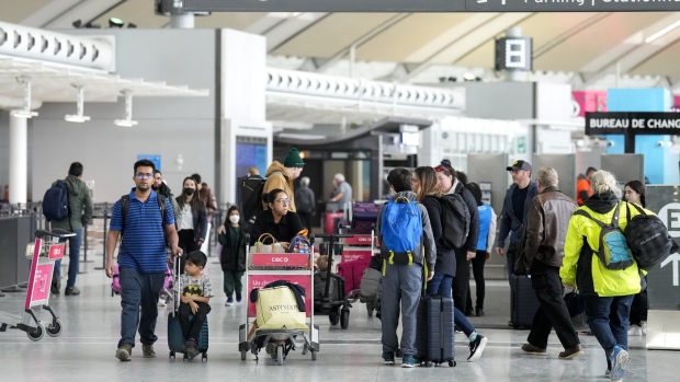 People are shown at Pearson International Airport in Toronto on Friday, March 10, 2023. THE CANADIAN PRESS/Nathan Denette