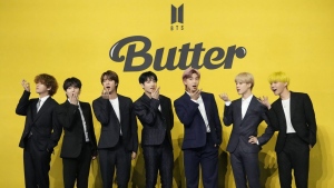 FILE - Members of South Korean K-pop band BTS, V, SUGA, JIN, Jung Kook, RM, Jimin, and j-hope from left to right, pose for photographers ahead of a news conference to introduce their new single "Butter" in Seoul, South Korea, May 21, 2021. The speculation over an untitled book can end, and it is BTS fans, not followers of Taylor Swift, who can rejoice. Flatiron Books announced Thursday, May 11, 2023, the book “4C Untitled Flatiron Nonfiction Summer 2023” was in fact about the mega-popular South Korean boy band, not Swift. (AP Photo/Lee Jin-man, File)