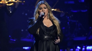 FILE - Kelly Clarkson performs during a tribute to Icon award winner Pink at the iHeartRadio Music Awards on Monday, March 27, 2023, at the Dolby Theatre in Los Angeles. Clarkson has responded, Saturday, May 13, to a Rolling Stone report accusing her daytime talk show of being a toxic workplace. She addressed the allegations after 11 current and former employees complained about being overworked and underpaid on “The Kelly Clarkson Show” in which they also called “traumatizing to their mental health” in the magazine’s Friday report. (AP Photo/Chris Pizzello, File)