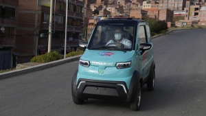 Dr. Carlos Ortuno drives a Bolivian-made, Quantum electric car to a house call, in La Paz, Bolivia, Wednesday, May 3, 2023. Launched in 2019, Quantum Motors has only sold 350 electric cars in Bolivia. But their founders recently received a boost from the German city of Bonn, which invested 50,000 euros to acquire six units in support of a local program that sends doctors to people's homes. (AP Photo/Juan Karita)
