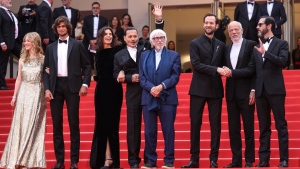Pauline Pollmann, from left, Diego Le Fur, director Maiwenn, Johnny Depp, Pierre Richard, Benjamin Lavernhe, Pascal Greggory, and Melvil Poupaud pose for photographers upon arrival at the opening ceremony and the premiere of the film 'Jeanne du Barry' at the 76th international film festival, Cannes, southern France, Tuesday, May 16, 2023. (Photo by Vianney Le Caer/Invision/AP)