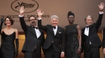 Phoebe Waller-Bridge, from left, director James Mangold, Harrison Ford, Shaunette Renee Wilson, and Mads Mikkelsen pose for photographers upon arrival at the premiere of the film 'Indiana Jones and the Dial of Destiny' at the 76th international film festival, Cannes, southern France, Thursday, May 18, 2023. (Photo by Scott Garfitt/Invision/AP)