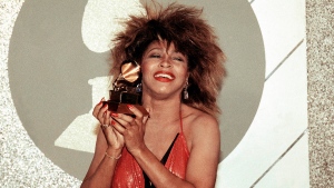 FILE - Tina Turner, Pop and R&B vocalist, as holds up a Grammy Award, Feb. 27, 1985, in Los Angeles. Turner, the unstoppable singer and stage performer, died Tuesday, after a long illness at her home in KÃ¼snacht near Zurich, Switzerland, according to her manager. She was 83 (AP Photo/Nick Ut, File)