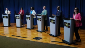 Josh Matlow (left) applauds a comment from Mitzi Hunter (centre left) as they are joined on stage by Olivia Chow (second left) Brad Bradford (centre right) Mark Saunders (second right) and Ana Bailao(right) at a Toronto Mayoral Candidates debate in Scarborough, Ont. on Wednesday, May 24, 2023. THE CANADIAN PRESS/Chris Young