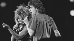 FILE - Singer Tina Turner, left, and Mick Jagger perform together during Live-Aid concert on July 14, 1985, in Philadelphia. Turner, the unstoppable singer and stage performer, died Tuesday, after a long illness at her home near Zurich, Switzerland, according to her manager. She was 83. (AP Photo/Rusty Kennedy, File)