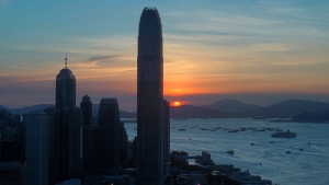The skyline of the business district is silhouetted at sunset in Hong Kong on Monday, July 13, 2020. (AP Photo/Vincent Yu)