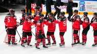 Canada celebrates after their semifinal match against Latvia at the Ice Hockey World Championship in Tampere, Finland, Saturday, May 27, 2023. Canada won 4-2. (AP Photo/Pavel Golovkin)