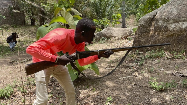 Joshua Danjuma with rifle in southern Nigeria