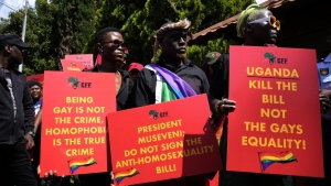 Activists hold placards during their picket against Uganda's anti-homosexuality bill at the Ugandan High Commission in Pretoria, South Africa on April 4, 2023.  (AP Photo/Themba Hadebe, File)