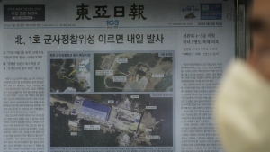 A local newspaper showing file images of the Sohae Satellite Launching Station in Tongchang-ri, North Korea, is displayed in Seoul, South Korea, Tuesday, May 30, 2023. North Korea said Tuesday it would launch its first military spy satellite in June and described space-based reconnaissance as crucial for monitoring the United States' "reckless" military exercises with South Korea. The headline reads "North Korea launches its first military spy satellite tomorrow at the earliest." (AP Photo/Ahn Young-joon)

