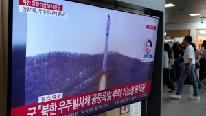 A TV screen shows a file image of North Korea's rocket launch during a news program at the Seoul Railway Station in Seoul, South Korea, Wednesday, May 31, 2023. North Korea launched a purported rocket Wednesday, a day after the country announced a plan to put its first military spy satellite into orbit, South Korea's military said. (AP Photo/Ahn Young-joon)