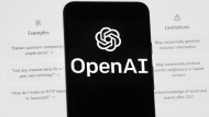 FILE - The OpenAI logo is seen on a mobile phone in front of a computer screen which displays the ChatGPT home Screen, on March 17, 2023, in Boston. (AP Photo/Michael Dwyer, File) 