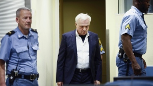 Former head of Serbia's state security service Jovica Stanisic arrives to appear in court at the UN International Residual Mechanism for Criminal Tribunals (IRMCT) in The Hague, Netherlands, Wednesday, May 31, 2023. United Nations appeals judges on Wednesday significantly expanded the convictions of two allies of late Serbian President Slobodan Milosevic, holding them responsible for involvement in crimes across Bosnia and in one town in Croatia as members of a joint criminal plan to drive out non-Serbs from the areas during the Balkan wars. (Piroschka van de Wouw/Pool Photo via AP)