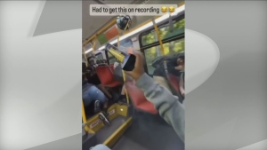 A firework is seen being set off inside a TTC bus in this still image taken from a video posted to social media. (SOURCE/REDDIT)