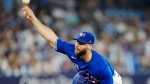 Toronto Blue Jays relief pitcher Anthony Bass (52) works against the Milwaukee Brewers during ninth inning MLB baseball action in Toronto on Wednesday, May 31, 2023.THE CANADIAN PRESS/Frank Gunn