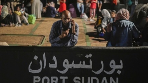 A Sudanese evacuee waits at Port Sudan before boarding a Saudi military ship to Jeddah port, on May 3, 2023. A doctor trying to co-ordinate basic medical services after Sudan's rapid descent into chaos says the government and militias are hampering lifesaving aid and leaving children dying, as Canada crafts its response to the crisis. THE CANADIAN PRESS/AP/Amr Nabil
