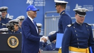 A cadet shakes hands with President Joe Biden after receiving his diploma during the United States Air Force Academy graduation ceremony, Thursday, June 1, 2023, at Air force Academy, Colo. (AP Photo/John Leyba)
