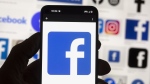 The Facebook logo is seen on a mobile phone, Oct. 14, 2022, in Boston. THE CANADIAN PRESS/AP-Michael Dwyer
