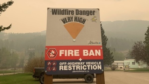 Blairmore area wildfire warning signage is shown in this handout image provided by the Government of Alberta Fire Service. As fire bans continue in many provinces, businesses selling camping gear and firewood are seeing a shift in demand. THE CANADIAN PRESS/HO-Government of Alberta Fire Service