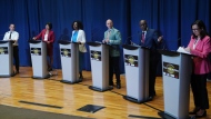 Toronto mayoral candidates Josh Matlow, left to right, Olivia Chow, Mitzie Hunter, Brad Bradford, Mark Saunders and Ana Bailao take the stage at a mayoral debate in Scarborough, Ont. on Wednesday, May 24, 2023. THE CANADIAN PRESS/Chris Young