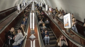 People take cover at a metro station during a Russian rocket attack in Kyiv, Ukraine, Monday, May 29, 2023. (AP Photo/Evgeniy Maloletka)