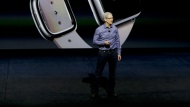 File - Apple CEO Tim Cook discusses the Apple Watch at the Apple event at the Bill Graham Civic Auditorium in San Francisco, Wednesday, Sept. 9, 2015. If Apple unveils a widely anticipated headset equipped with mixed reality technology on Monday, it will be the company's biggest new product since the introduction of the Apple Watch nearly a decade ago. (AP Photo/Eric Risberg, File)
