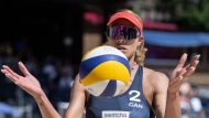 Canada's Brandie Wilkerson holds the ball during a quarter final game against Australia at the Elite Beach Pro Tour, on Saturday, July 9, 2022, in Gstaad, Switzerland. THE CANADIAN PRESS/Peter Schneider/Keystone via AP
