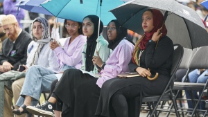 Hundreds gather on a rainy evening at a vigil for the Afzaal family in London, Ont., Monday, June 6, 2022. An upcoming vigil marks the second anniversary of London's largest mass killing. THE CANADIAN PRESS/ Geoff Robins