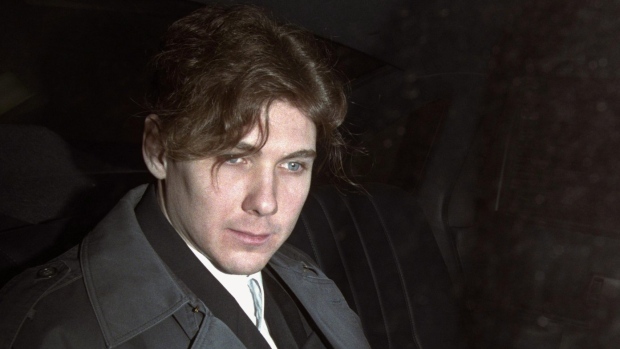 Paul Bernardo sits in the back of a police cruiser as he leaves a hearing in St. Catharines, Ont., April 5, 1994. The lawyer for the families of Paul Bernardo's victims says the killer and serial rapist should be returned to his maximum-security prison and transparency be provided around what led to his transfer to a medium-security facility in the first place.THE CANADIAN PRESS/Frank Gunn
