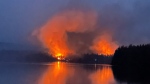 A wildfire burns near to Centennial Lake, near Matawatchan, Ont., on Sunday, June 4, 2023. The wildfire burning around Centennial Lake, about 150 kilometres west of Ottawa, was one of the 21 new fire starts in Ontario since Sunday, said fire adviser Shayne McCool, with the Ministry of Natural Resources and Forestry. THE CANADIAN PRESS/HO-Mike Coates
