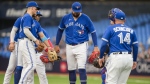 Toronto Blue Jays starting pitcher Alek Manoah (6) steps off the mound before being pulled by manager John Schneider (14) against the Houston Astros in first inning American League MLB baseball action in Toronto on Monday, June 5, 2023. THE CANADIAN PRESS/Andrew Lahodynskyj
